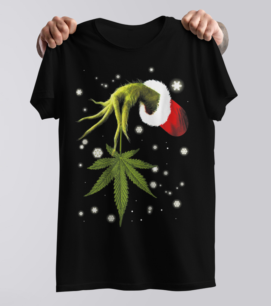 Grinch Hand Holding Cannabis Leaf With Santa Hat And Snowflakes T-Shirt