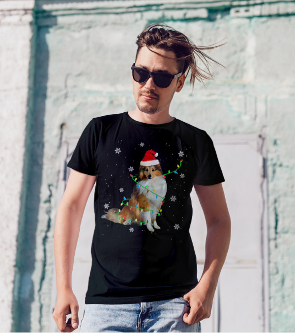 Shetland Sheepdog Wrapped In Christmas Lights With Santa Hat And Snowflakes T-Shirt