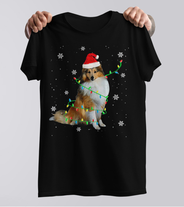 Shetland Sheepdog Wrapped In Christmas Lights With Santa Hat And Snowflakes T-Shirt