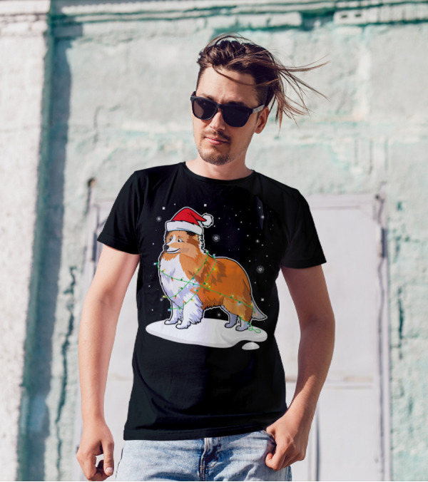 Sheltie Dog Santa Wrapped In Christmas Lights On Snowy Night T-Shirt