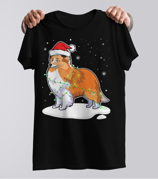 Sheltie Dog Santa Wrapped In Christmas Lights On Snowy Night T-Shirt