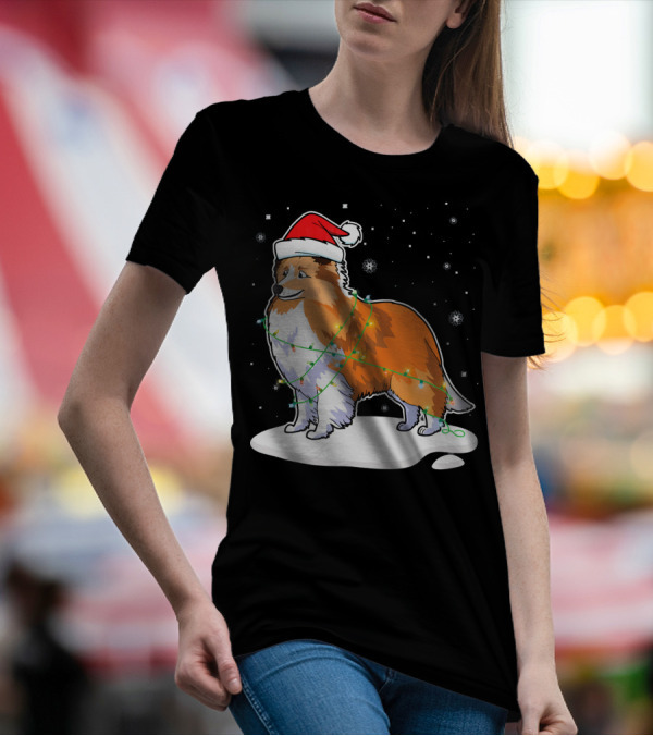Sheltie Dog Santa Wrapped In Christmas Lights On Snowy Night T-Shirt