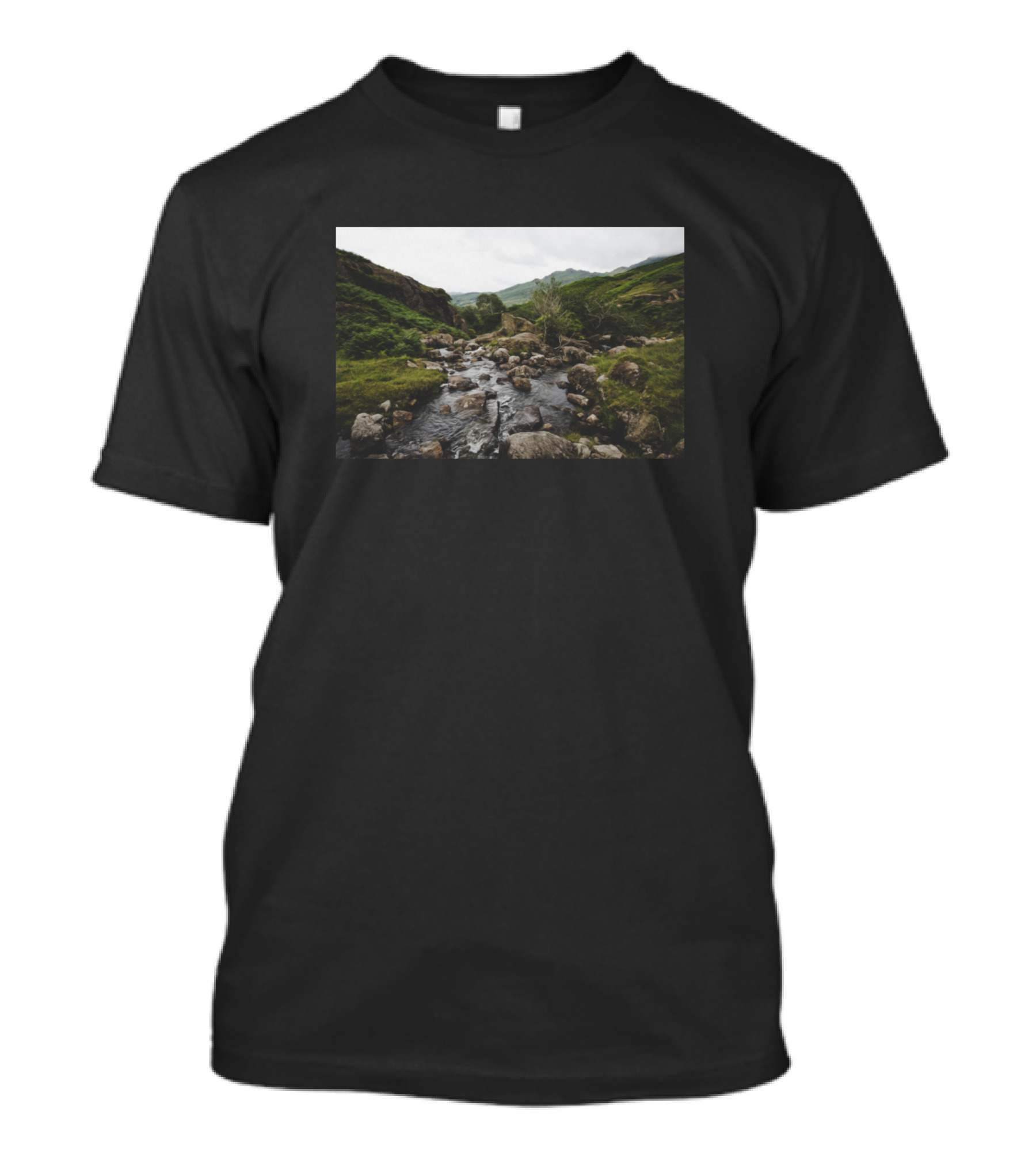 Lush Green Grass Surrounding Rocky River Amidst Nature's Tranquil Landscape T-Shirt