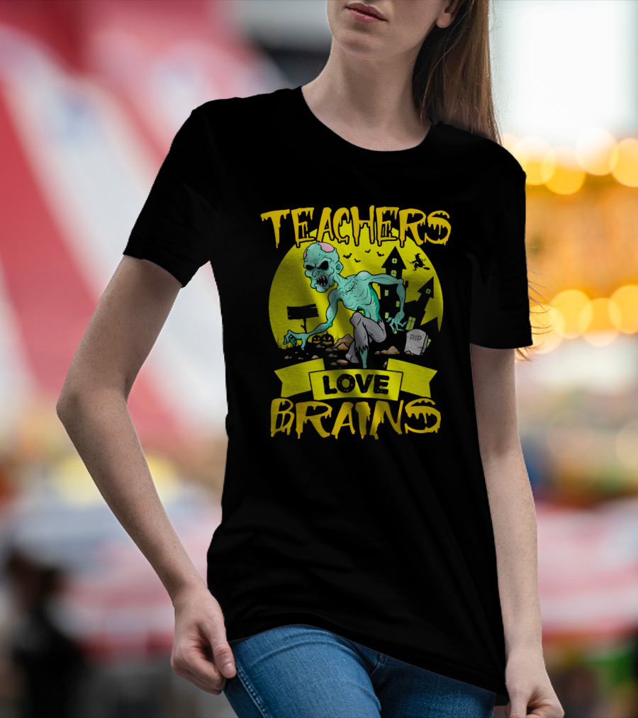 Teachers Love Brains Zombie Halloween Theme With Haunted Houses And Graveyard Background T-Shirt