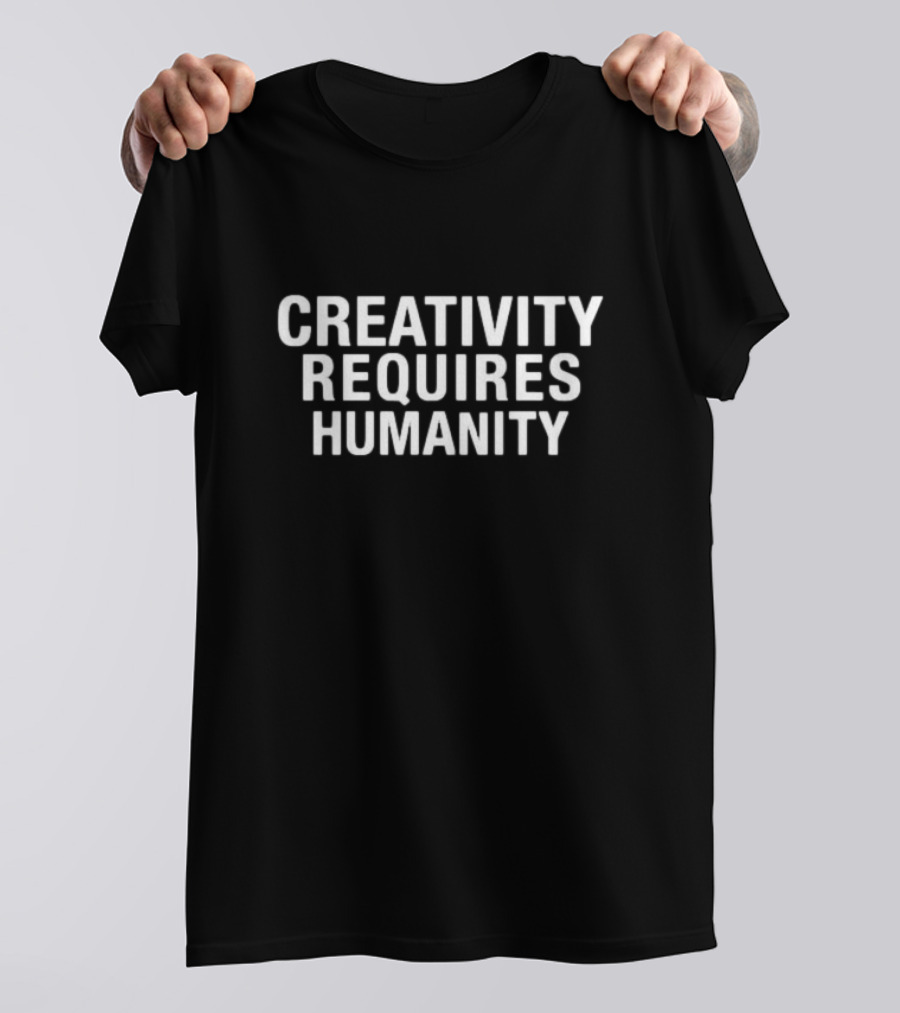 CREATIVITY REQUIRES HUMANITY Textual Emphasis In Bold White Letters T-Shirt