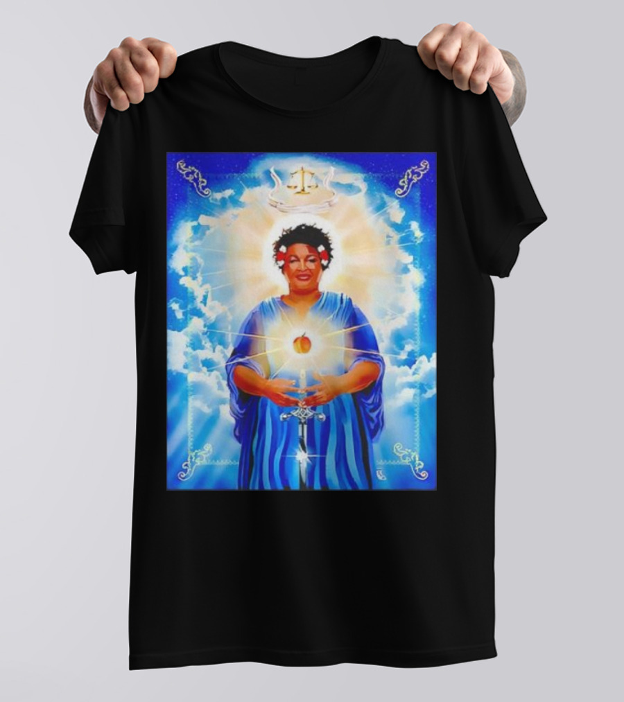 Stacey Abrams Patron Saint Of Fairness In Voting With Scales Of Justice Halo And Glowing Apple In Celestial Clouds T-Shirt