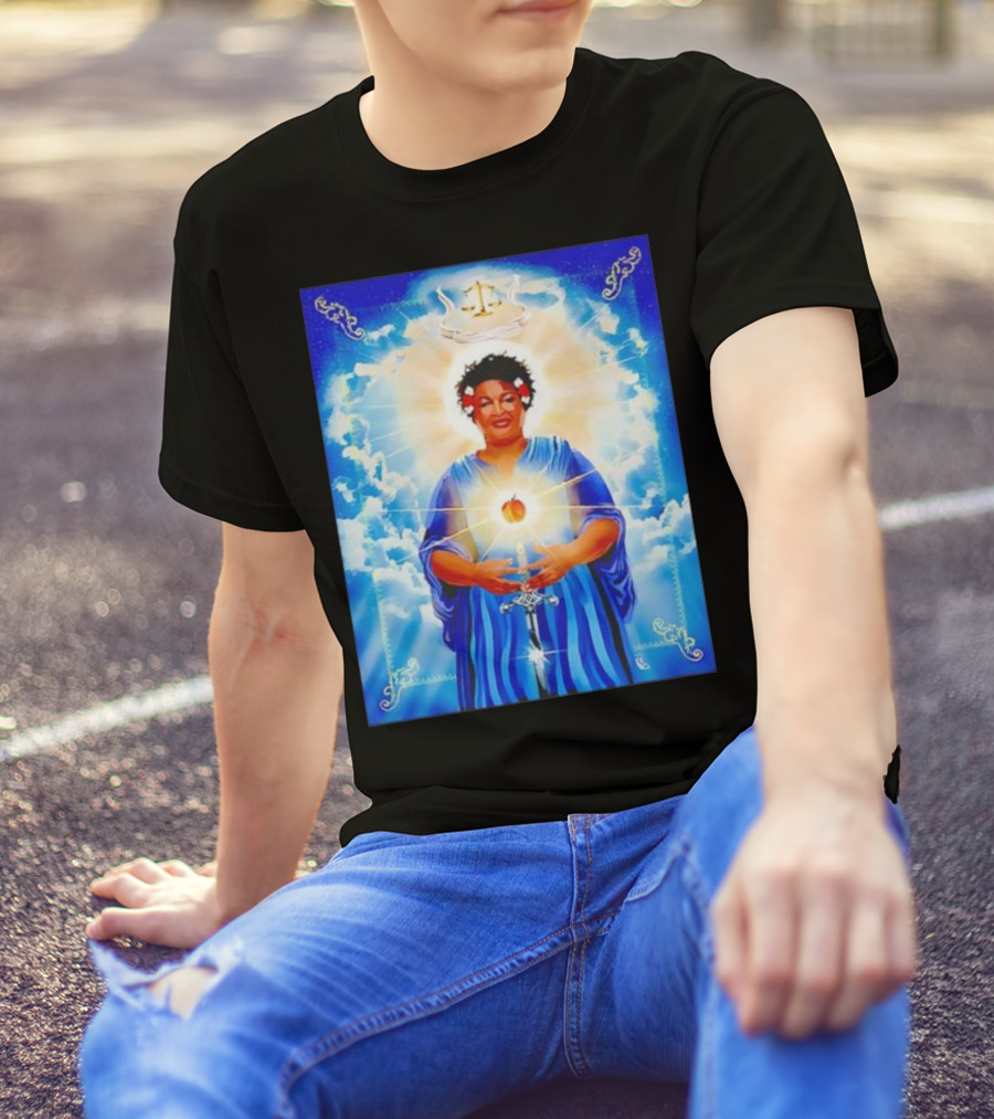 Stacey Abrams Patron Saint Of Fairness In Voting With Scales Of Justice Halo And Glowing Apple In Celestial Clouds T-Shirt