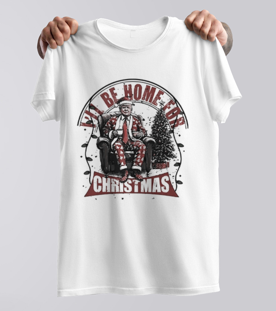 I'LL BE HOME FOR CHRISTMAS Donald Trump Sitting By Christmas Tree T-Shirt
