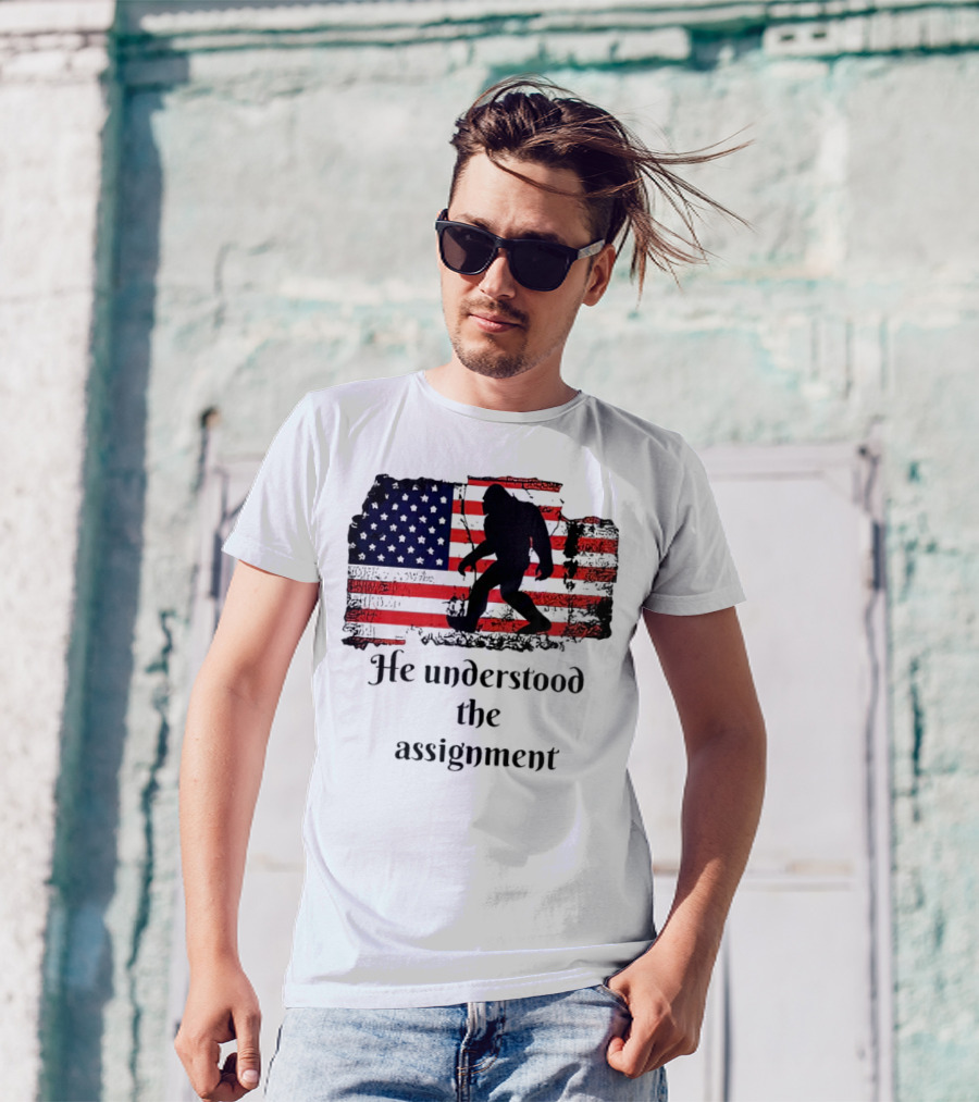 Bigfoot Silhouette With Distressed American Flag He Understood The Assignment T-Shirt