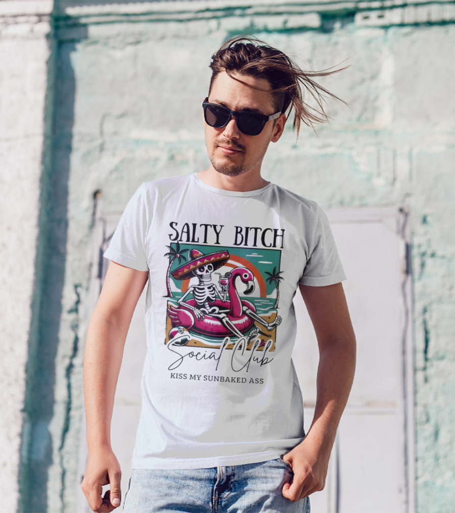 Salty Bitch Skeleton On Flamingo Float In Sunset Beach Scene With Kiss My Sunbaked Ass Text T-Shirt