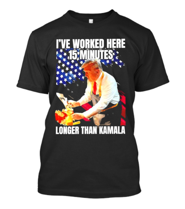 I’ve Worked Here 15 Minutes Longer Than Kamala Donald Trump American Flag Background T-Shirt