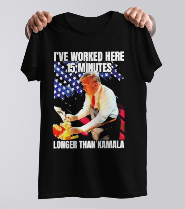 I’ve Worked Here 15 Minutes Longer Than Kamala Donald Trump American Flag Background T-Shirt