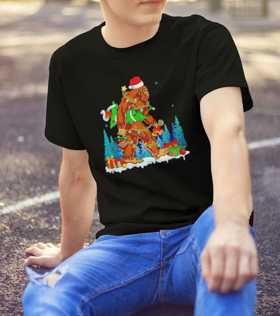 Bigfoot Santa Hugging Christmas Tree With Gifts And Snow Scene T-Shirt