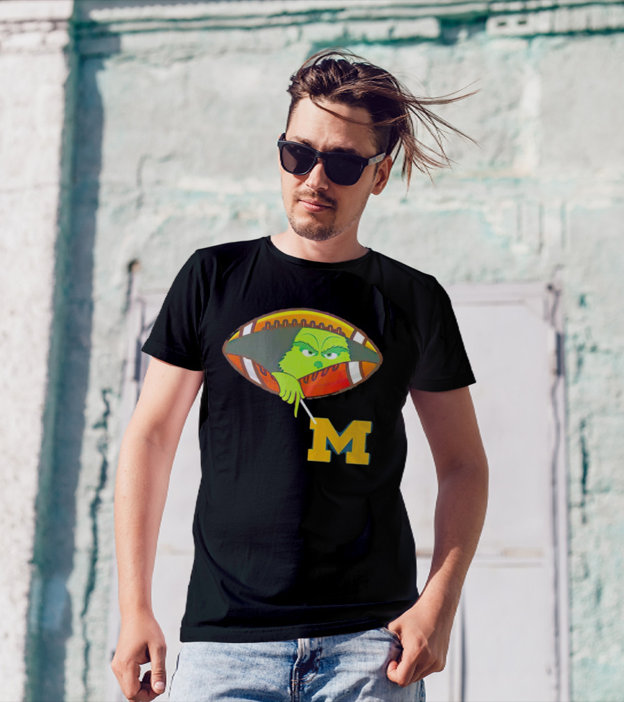 Grinch Peeking From Football Over Michigan Wolverines T-Shirt