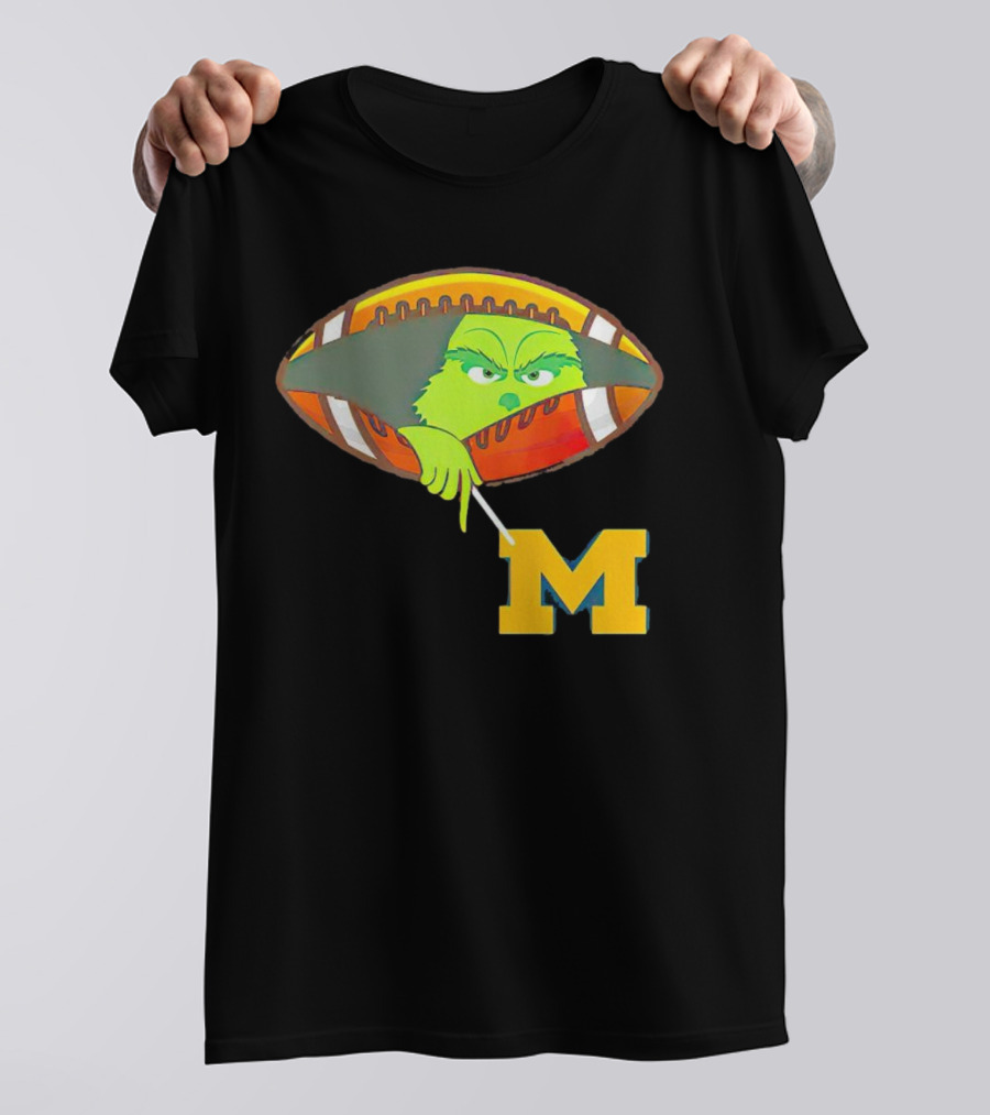 Grinch Peeking From Football Over Michigan Wolverines T-Shirt