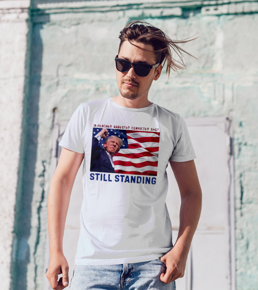 Still Standing Trump Impeached Arrested Convicted Shot American Flag Background T-Shirt
