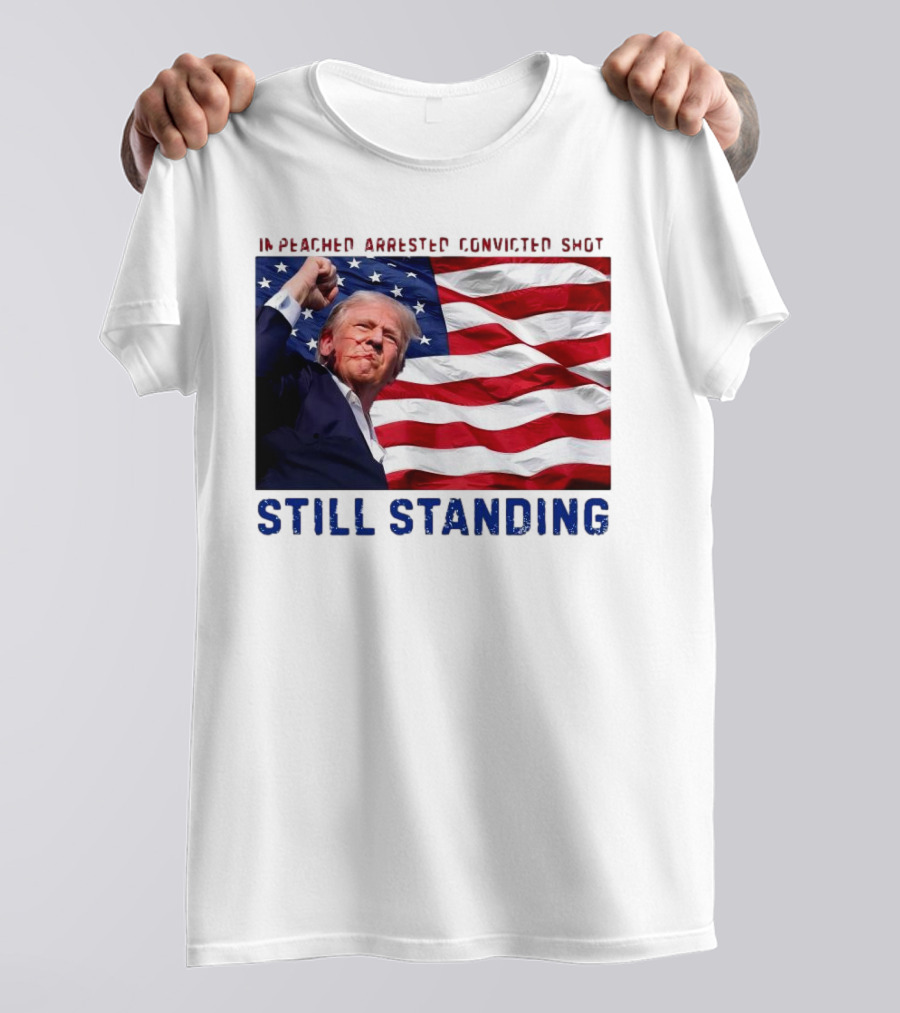 Still Standing Trump Impeached Arrested Convicted Shot American Flag Background T-Shirt
