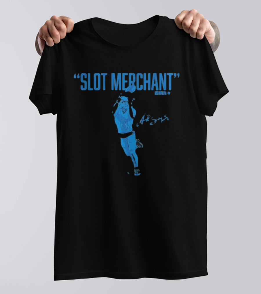 Amon-Ra St. Brown Slot Merchant Catching Football In Blue T-Shirt