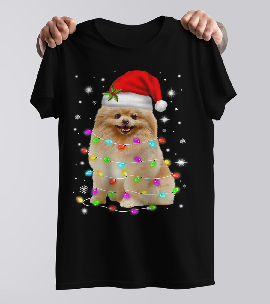 Pomeranian Pup Wrapped In Christmas Lights With Santa Hat And Festive Glow T-Shirt