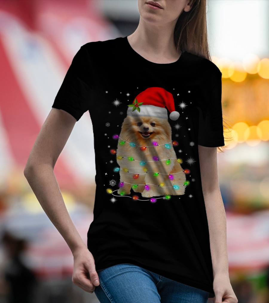 Pomeranian Pup Wrapped In Christmas Lights With Santa Hat And Festive Glow T-Shirt